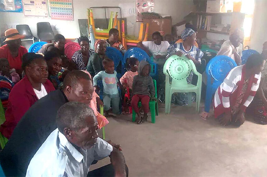 NAmibian adults and children at kinterdarten meeting